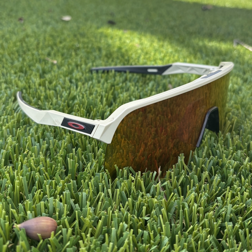 Oakley Sunglasses with Red Lens and Beige Accents